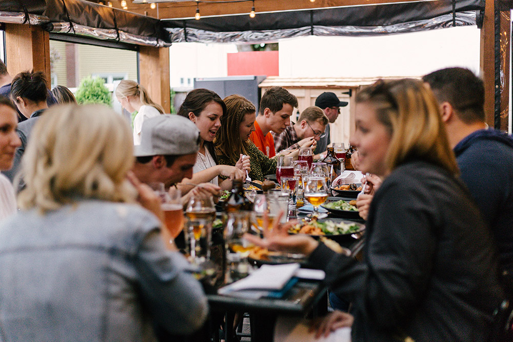 People eating a meal and talking (Unsplash/Priscilla Du Preez)